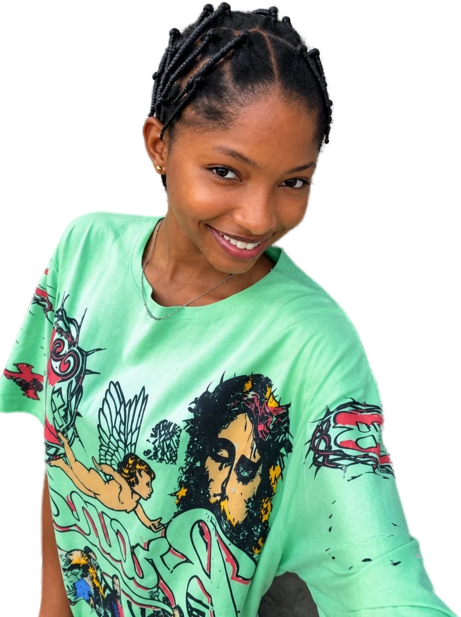 Soma smiling in a mint green tee